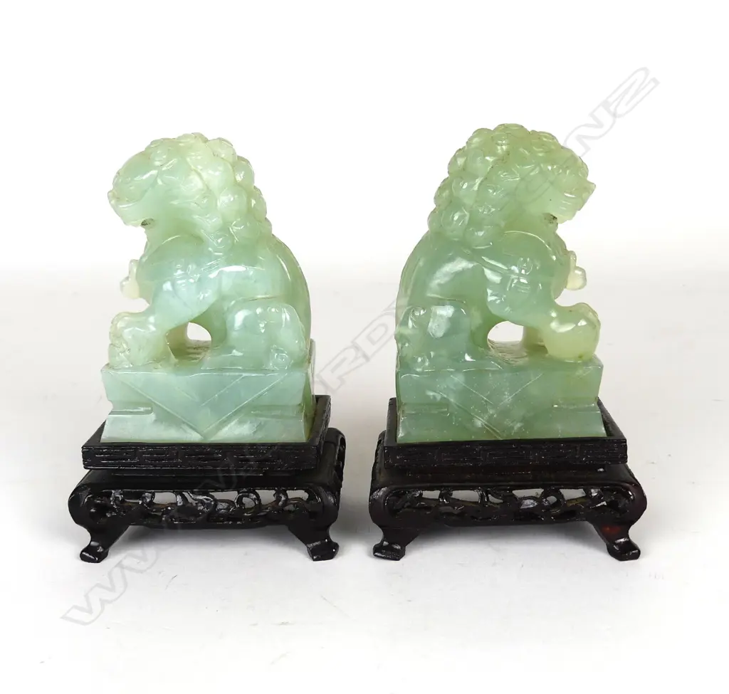 A pair of Chinese carved jade foo dogs Image 1++