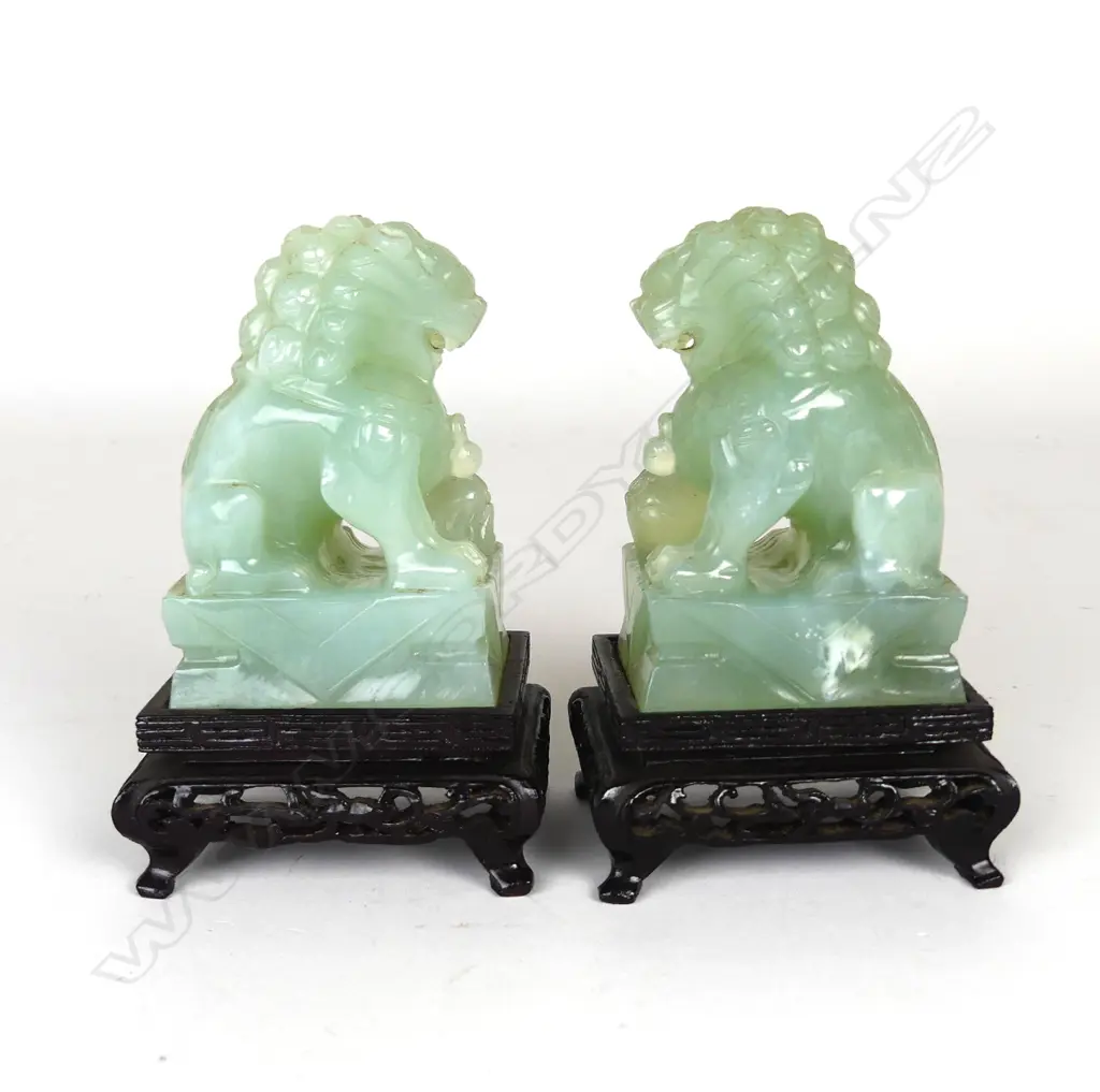 A pair of Chinese carved jade foo dogs Image 1++