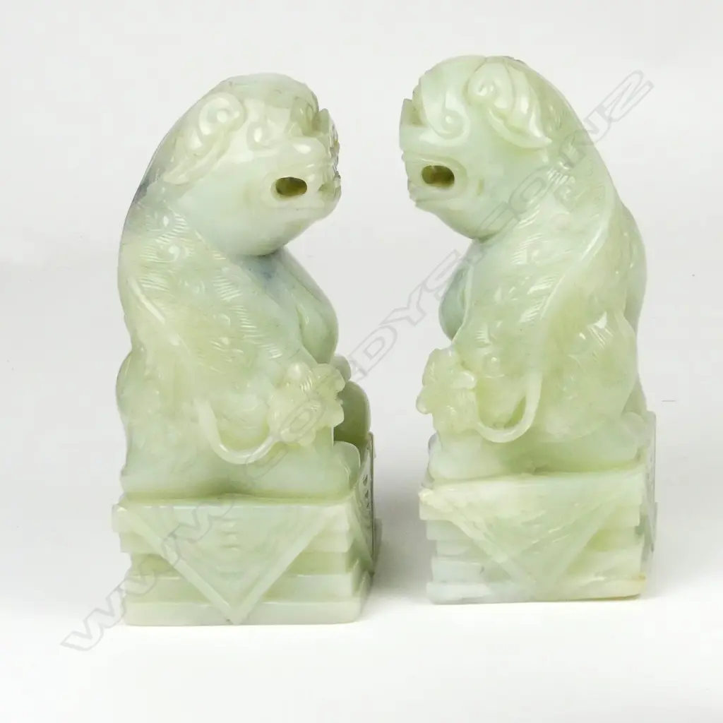 A pair of large Chinese pale jade foo dogs Image 1++