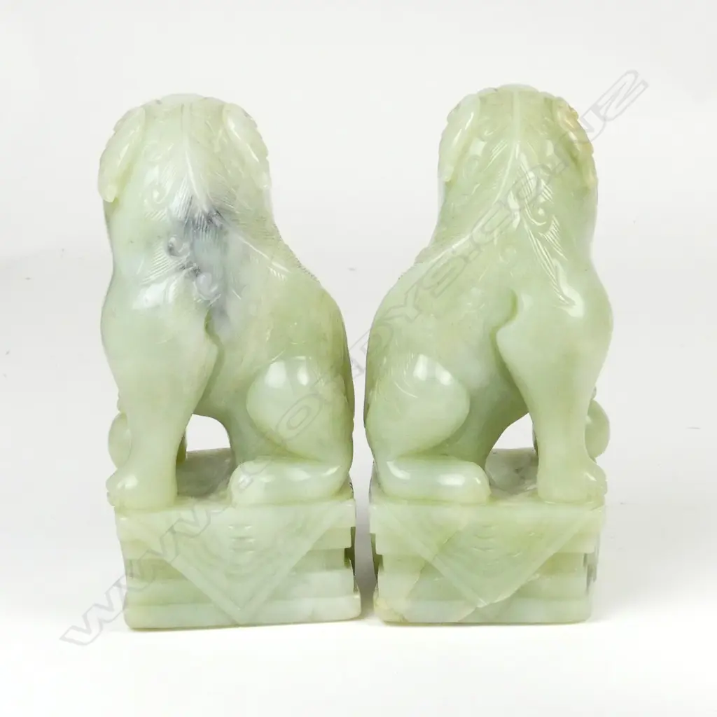 A pair of large Chinese pale jade foo dogs Image 1++