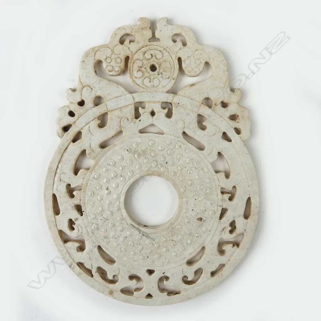 A Chinese white jade bi disc Image 1++