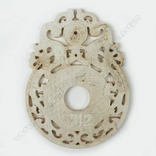 A Chinese white jade bi disc