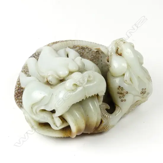 A large Chinese jade carving of two qilin