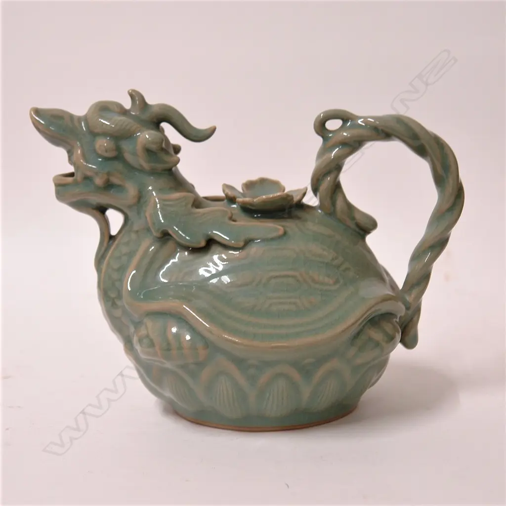A celadon glazed figural teapot Image 1++