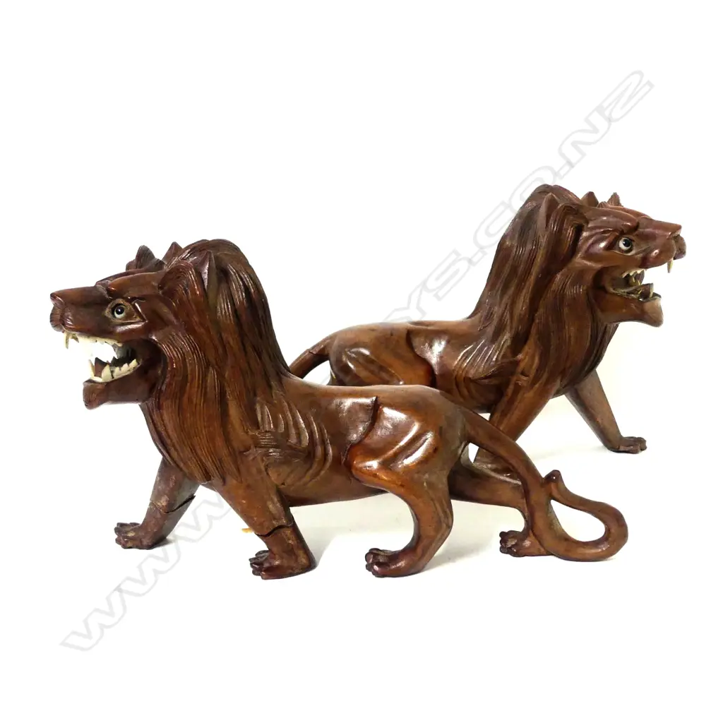 A pair of early 20thC Chinese hardwood carved prowling lions Image 1++