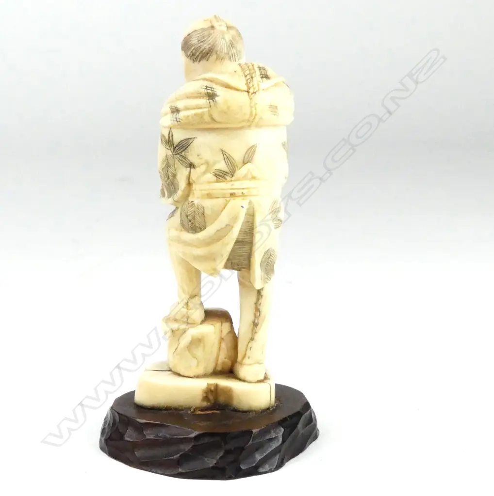 A Japanese marine ivory figure of an agricultural worker Image 1++