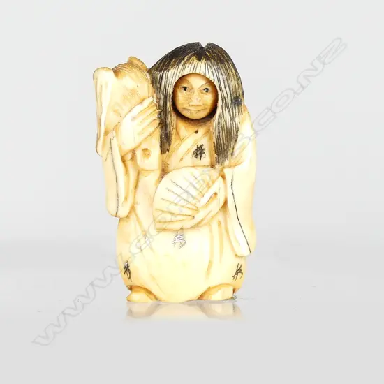 A Japanese netsuke of a demon