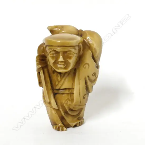 A tagua nut carved netsuke