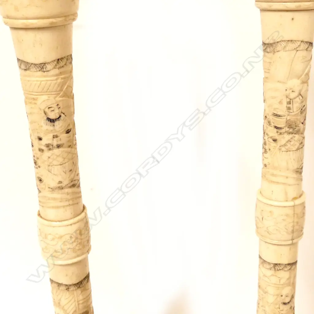 A pair of Japanese carved bone candlesticks Image 1++