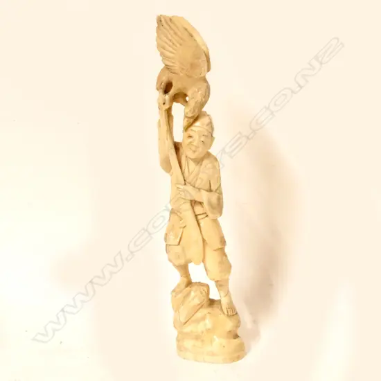 A Japanese carved marine ivory figure
