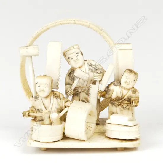 A Japanese ivory figure group