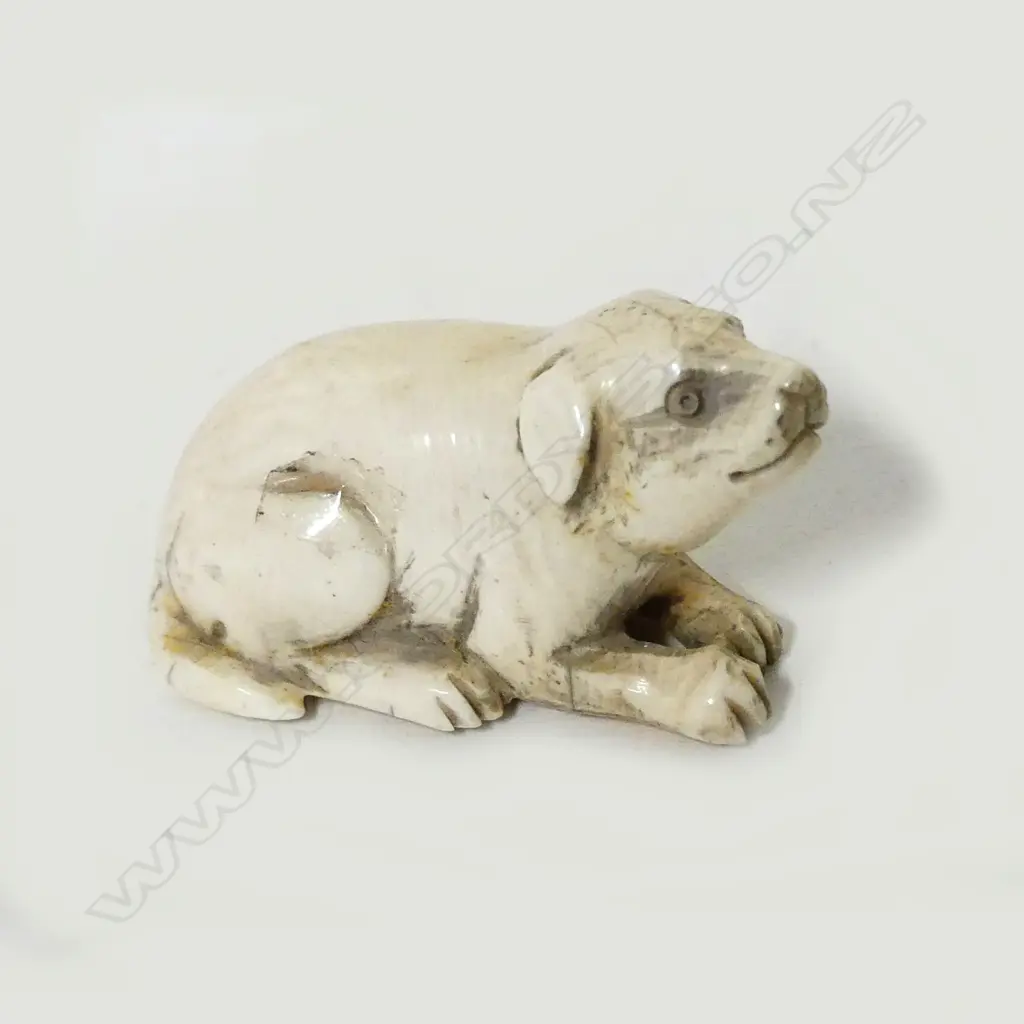 A small ivory netsuke of a puppy Image 1++