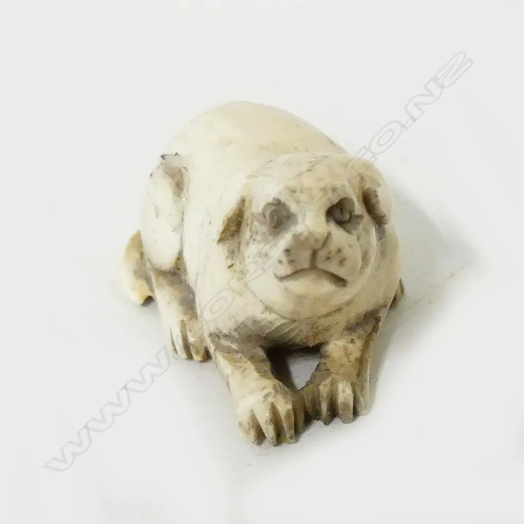A small ivory netsuke of a puppy Image 1++