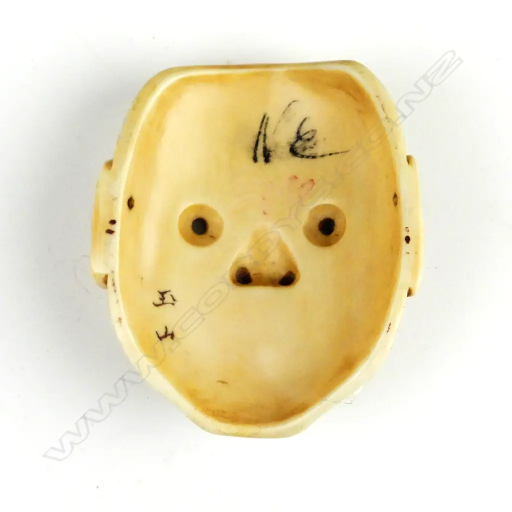 A diminutive Japanese ivory mask Image 1++