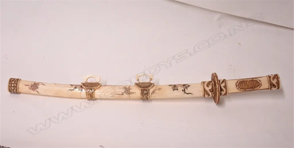 A Japanese carved bone short sword Image 1++
