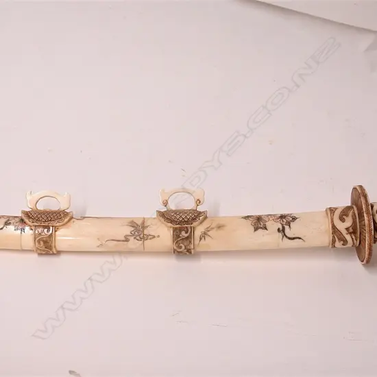 A Japanese carved bone short sword