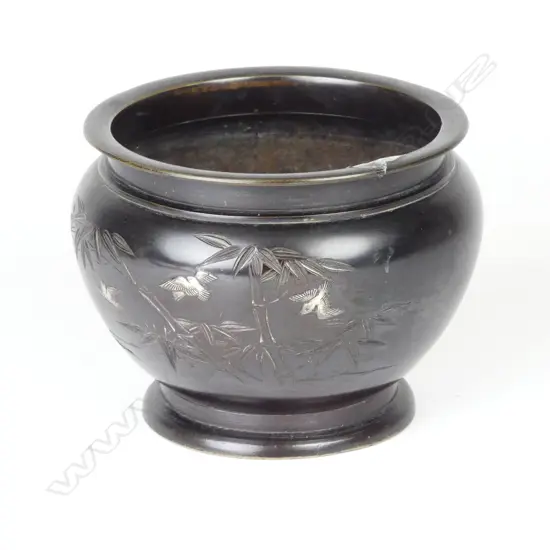 A Japanese Meiji bronze small jardinière with silver bird overlay