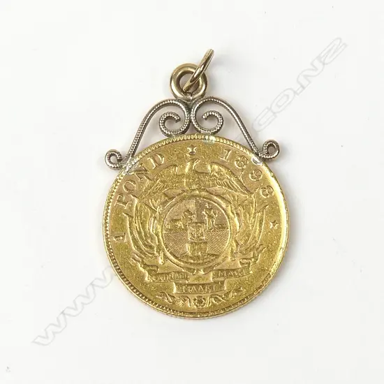 A gold South African one pound coin