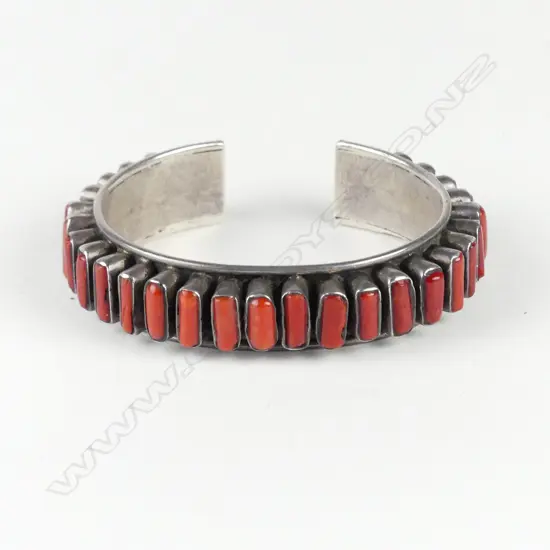 A vintage Afghani silver and red coral mounted cuff bangle