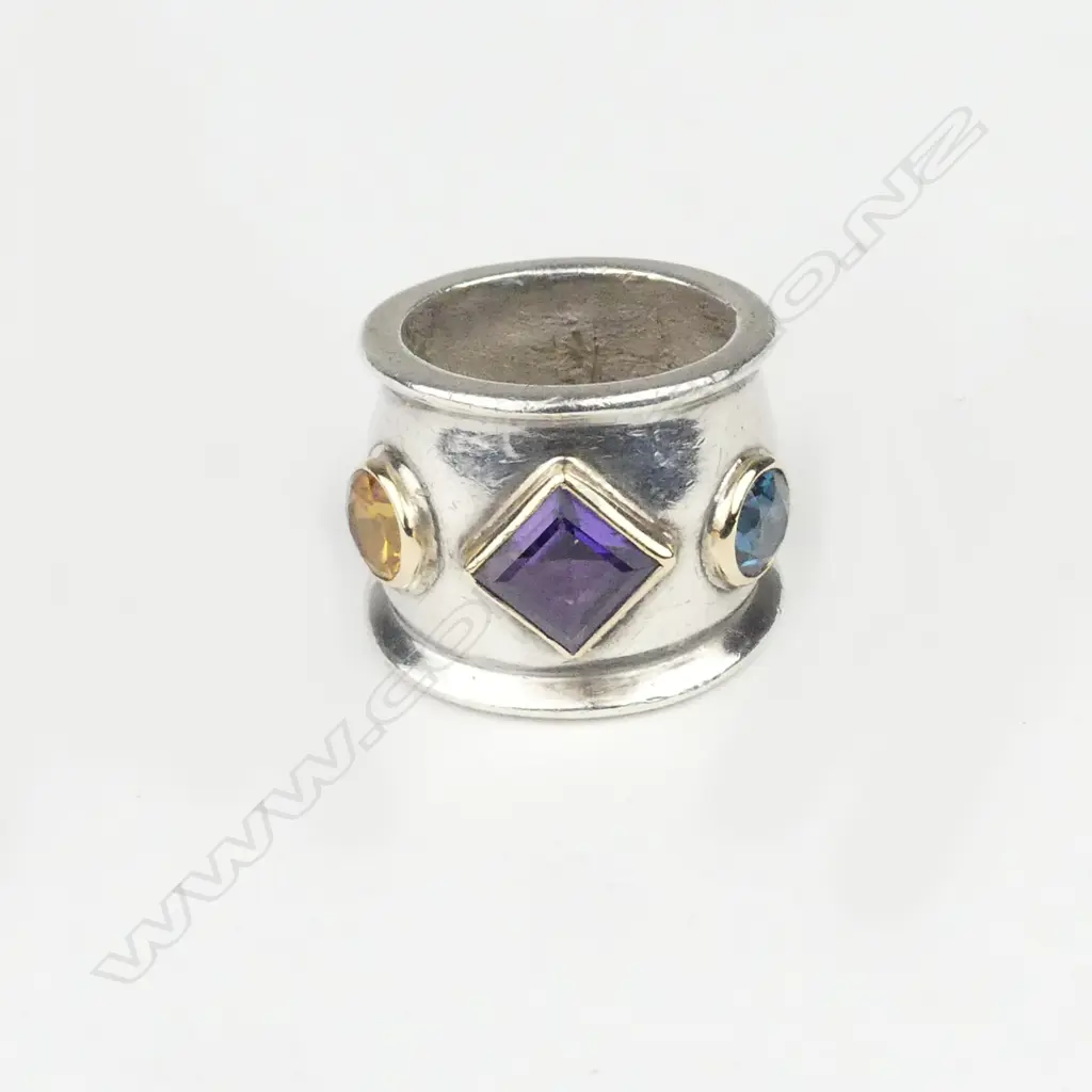 An 80's designer silver gold amethyst and peridot ring Image 1++