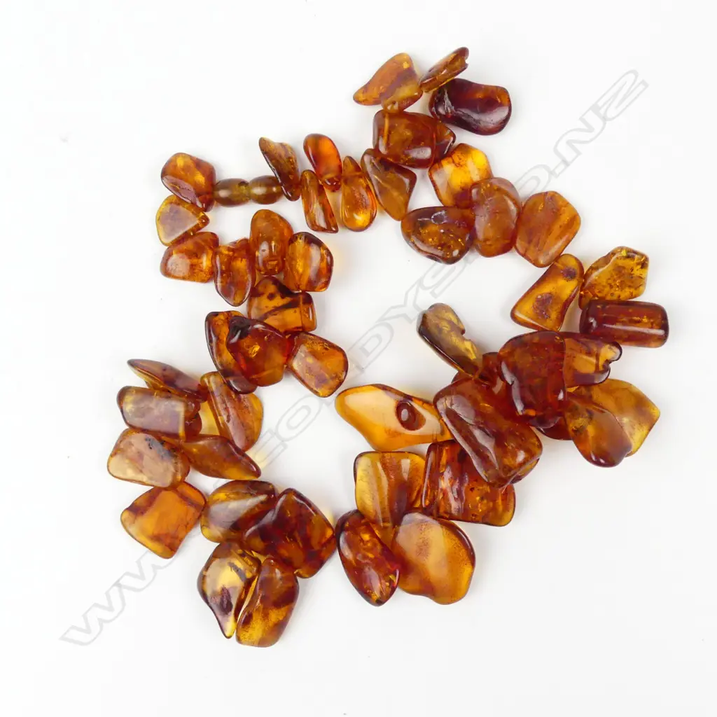 A Baltic amber flat nugget graduated necklace Image 1++