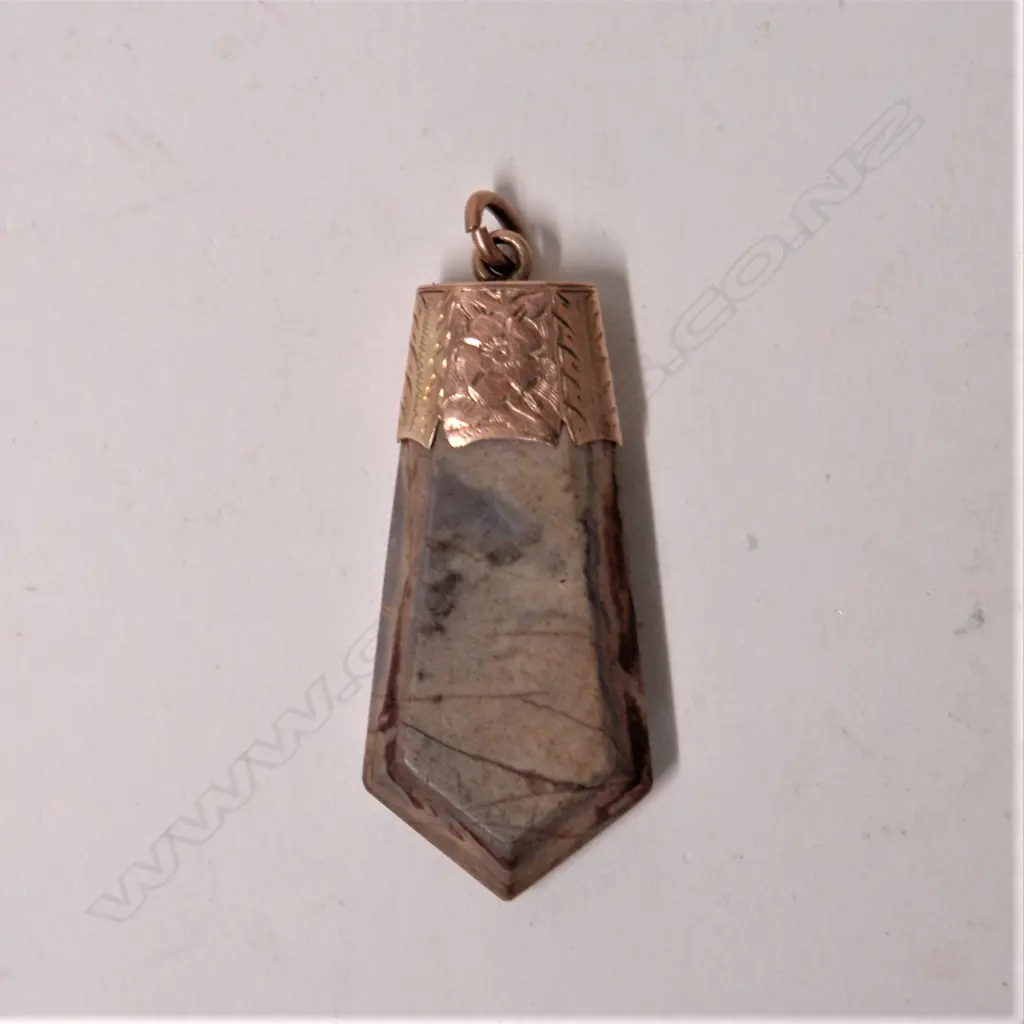 A late 19thC 9ct. rose gold mounted petrified wood fob pendant Image 1++