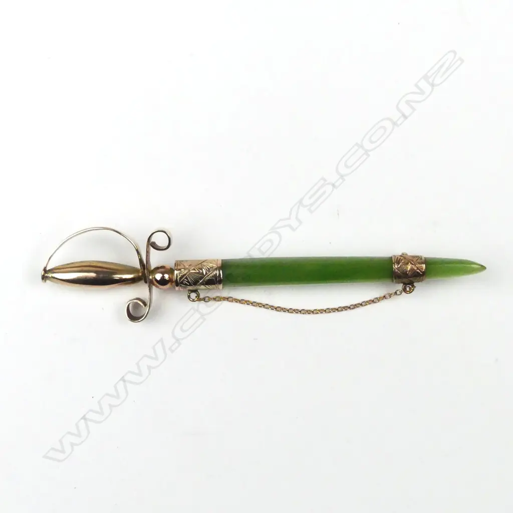 A N.Z. colonial 9ct. yellow gold and greenstone sword bar brooch Image 1++