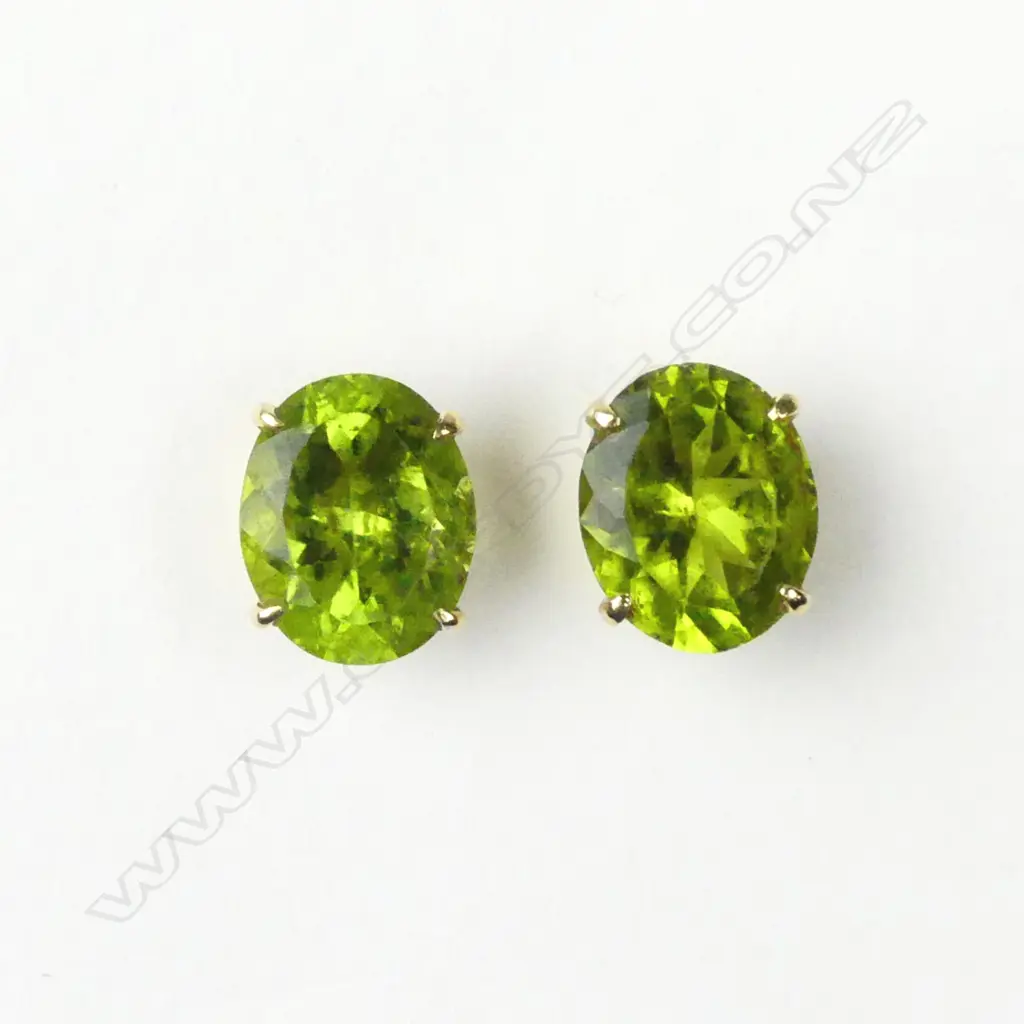 A pair of 18ct gold and peridot stud earrings Image 1++