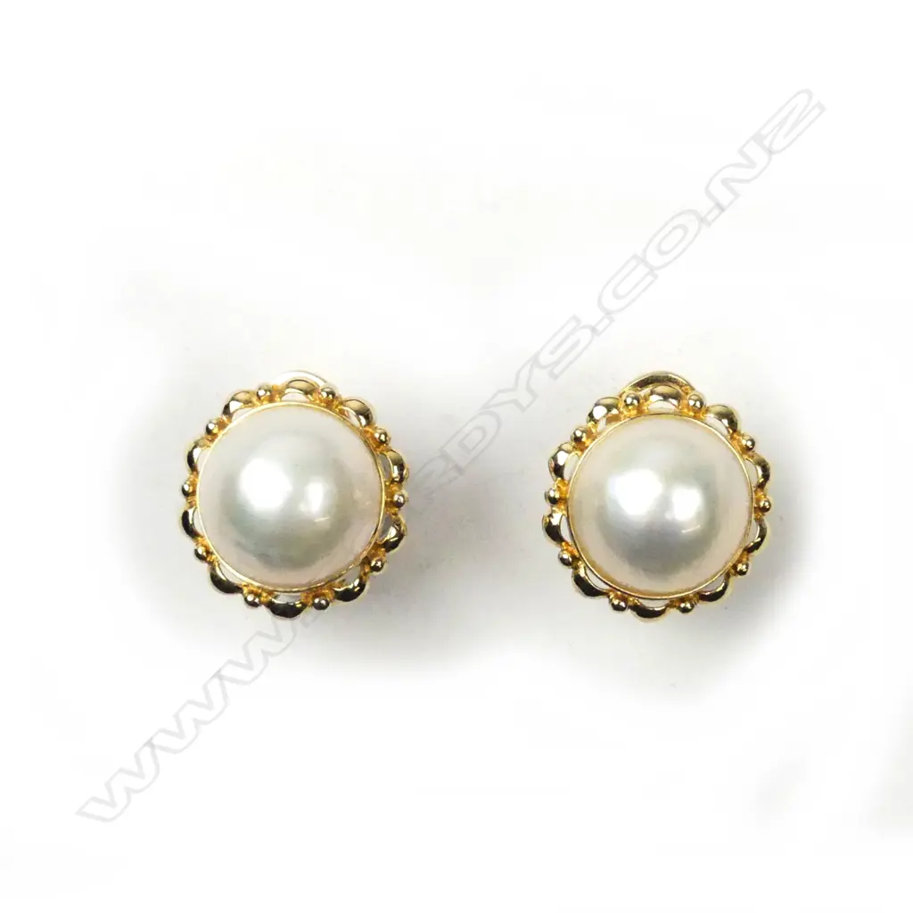 A pair of 14ct gold and mabe pearl earrings Image 1++