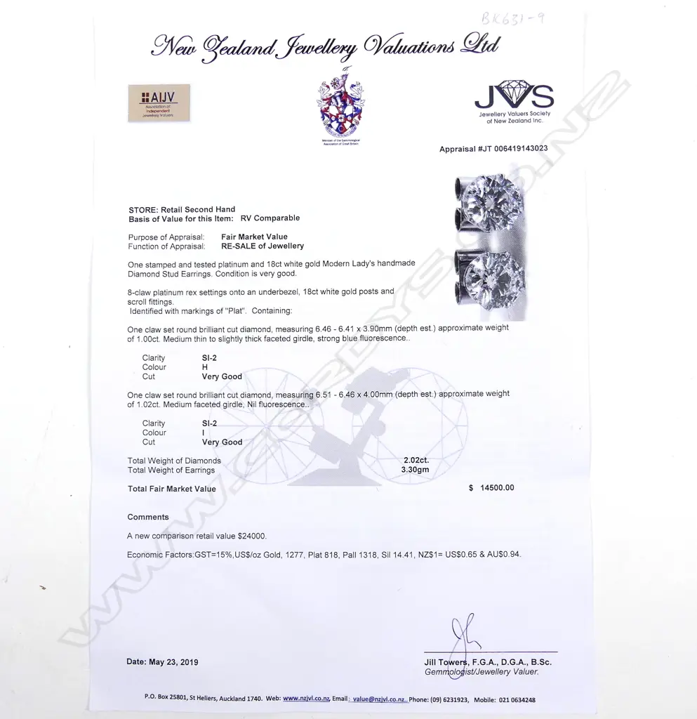 A pair of platinum and 18ct white gold 1ct ea. diamond stud earrings Image 1++