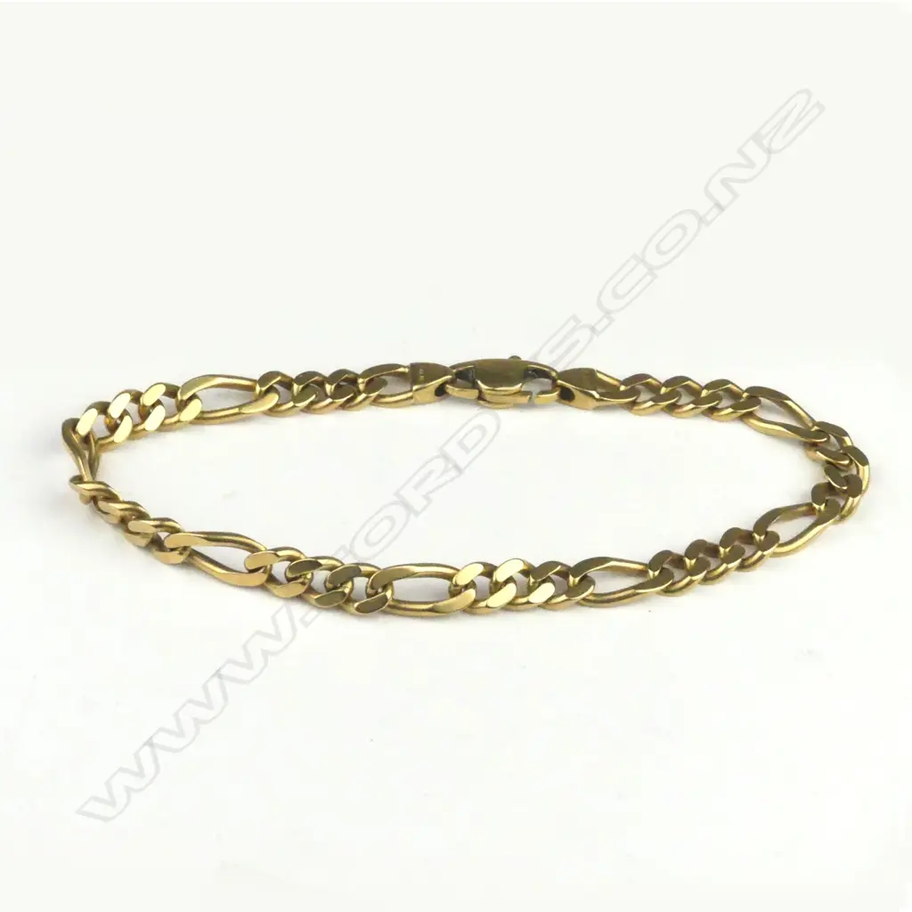 An 18ct. gold flat curb link bracelet Image 1++