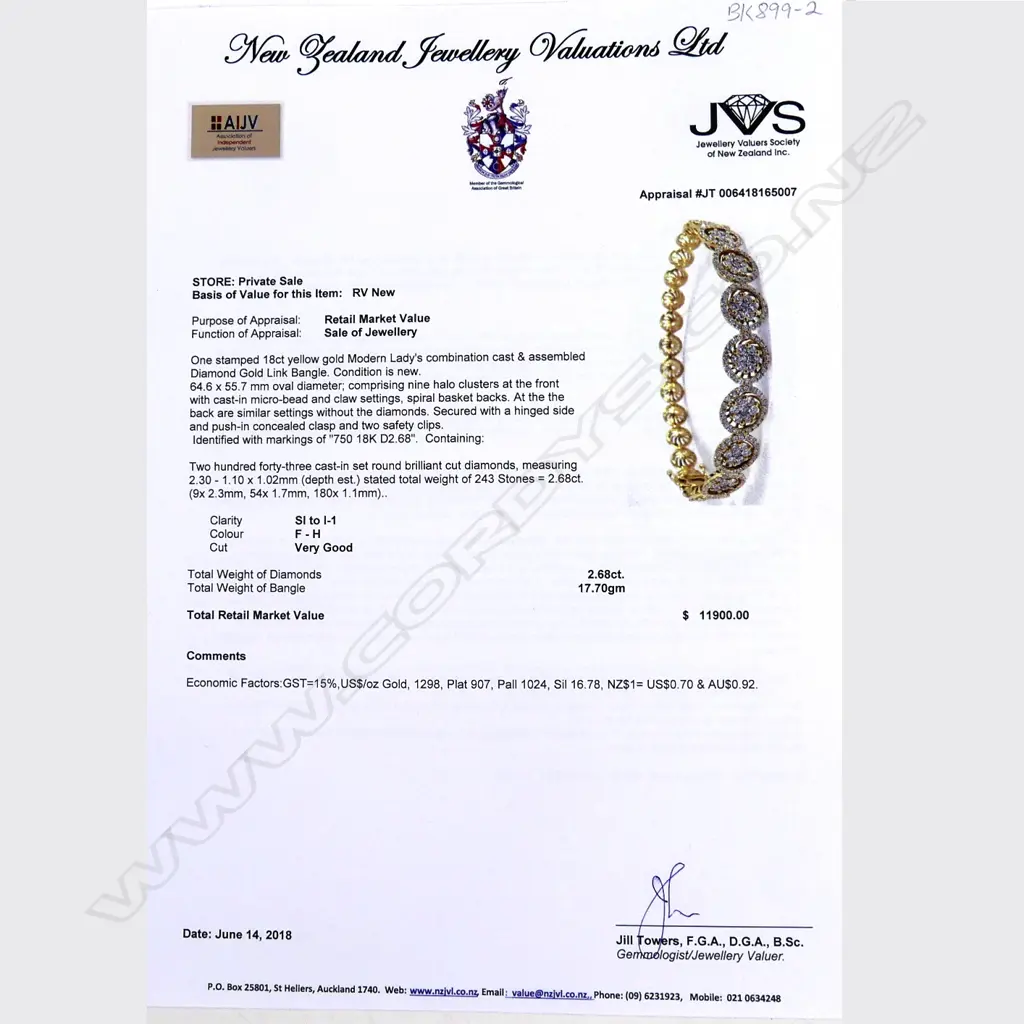 An 18ct gold and diamond hinged bangle Image 1++