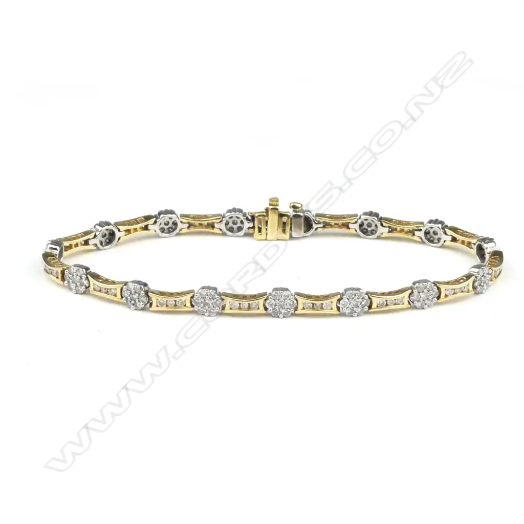 An 18ct yellow & white gold diamond tennis type bracelet Image 1++