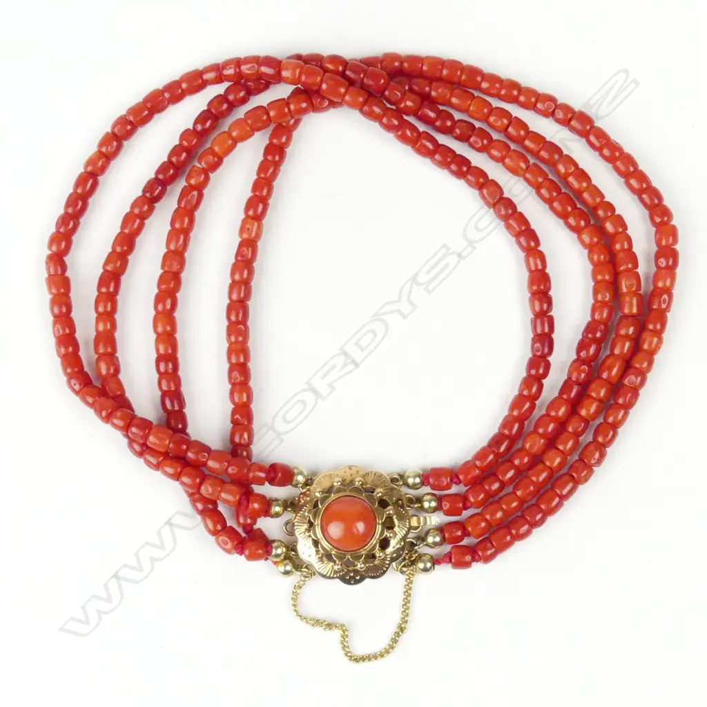An estate 18ct gold and coral bracelet Image 1++