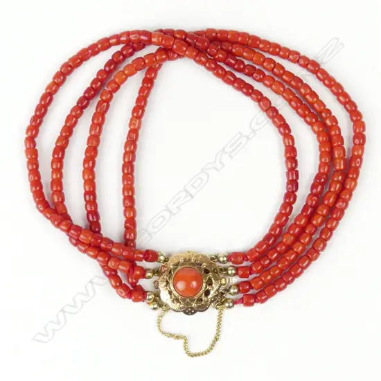 An estate 18ct gold and coral bracelet