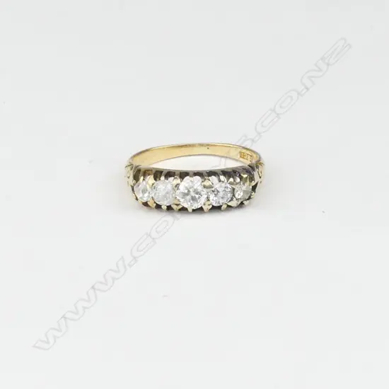 An 18ct gold and five stone diamond ring