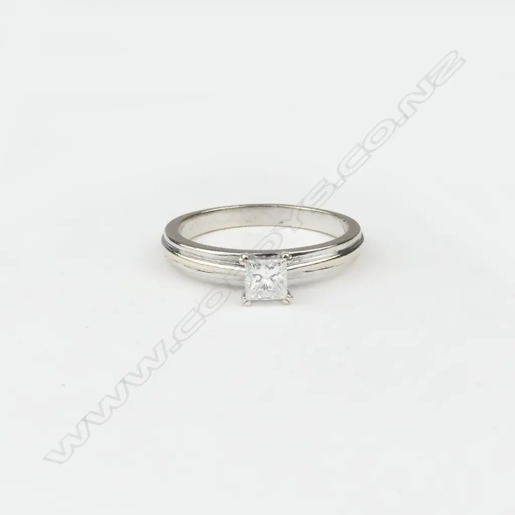 An 18ct white gold and diamond solitaire ring Image 1++
