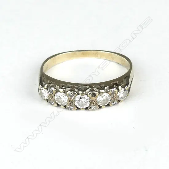 A lady's vintage gold and five stone diamond ring