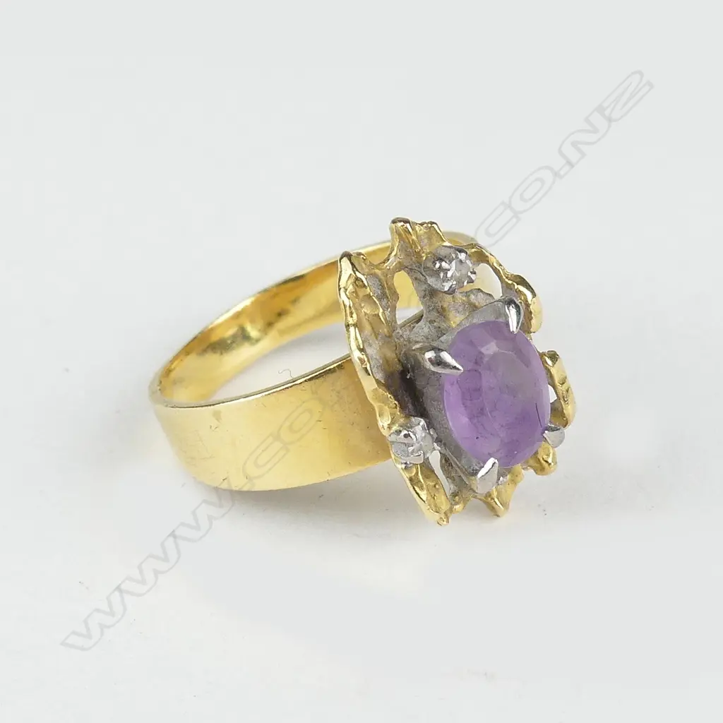 A 1960s designer high carat yellow gold amethyst and diamond ring Image 1++