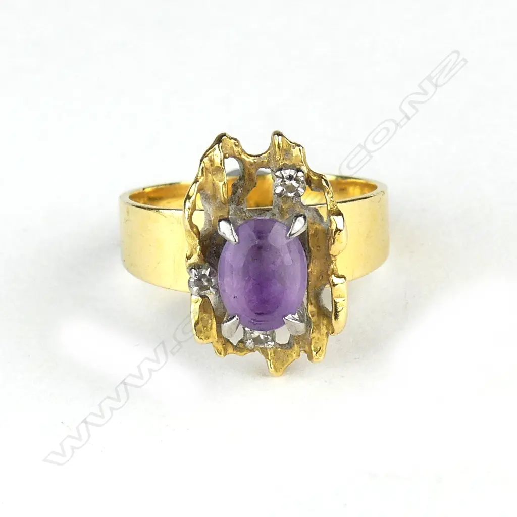 A 1960s designer high carat yellow gold amethyst and diamond ring Image 1++