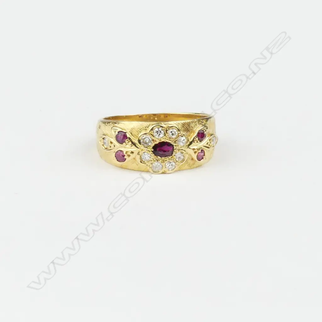 An 18ct gold diamond and ruby ring Image 1++