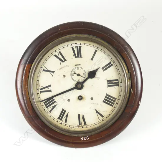 A mahogany framed circular wall clock
