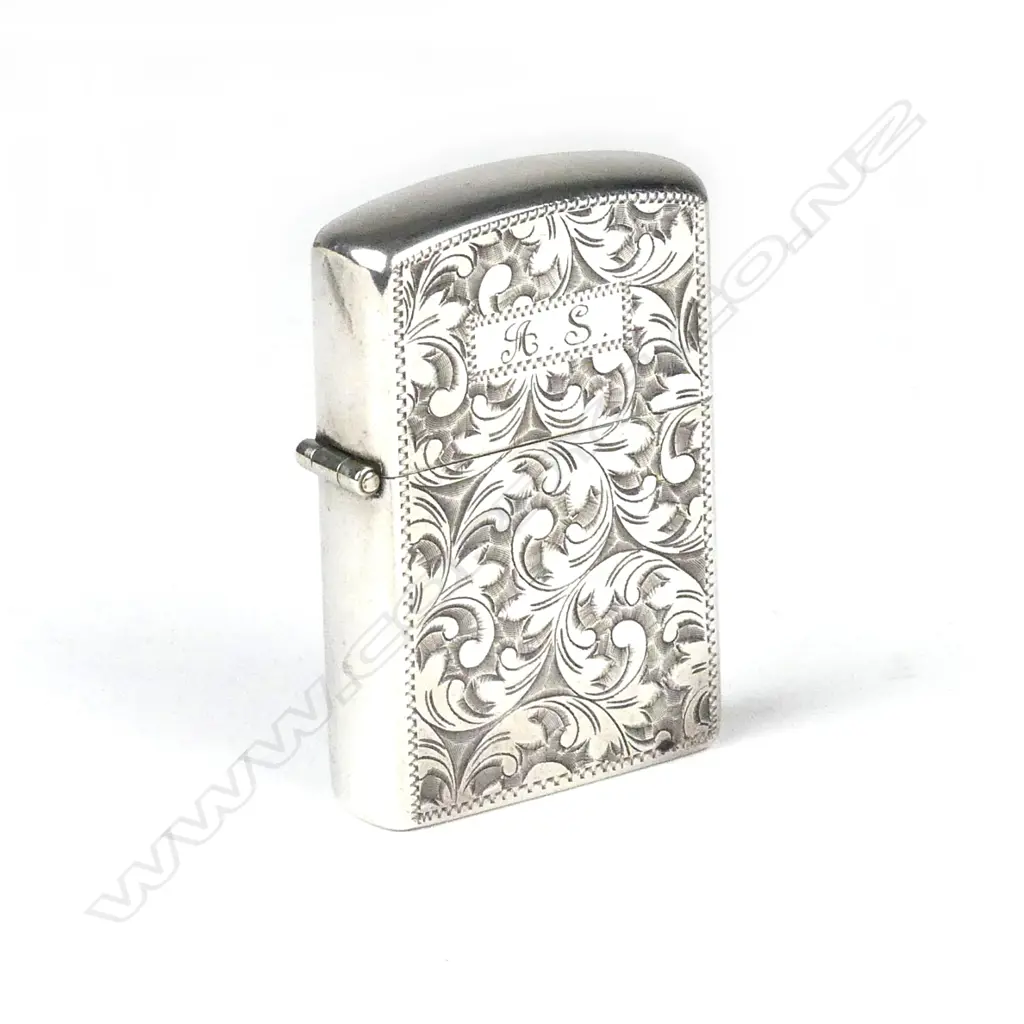 A silver cased Zippo lighter Image 1++