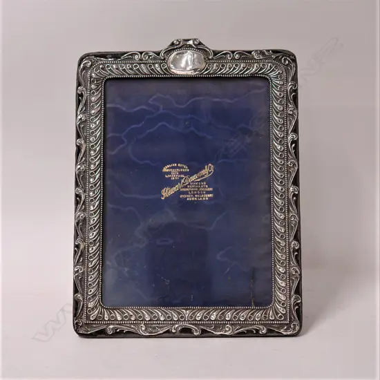An Edwardian silver large photo frame
