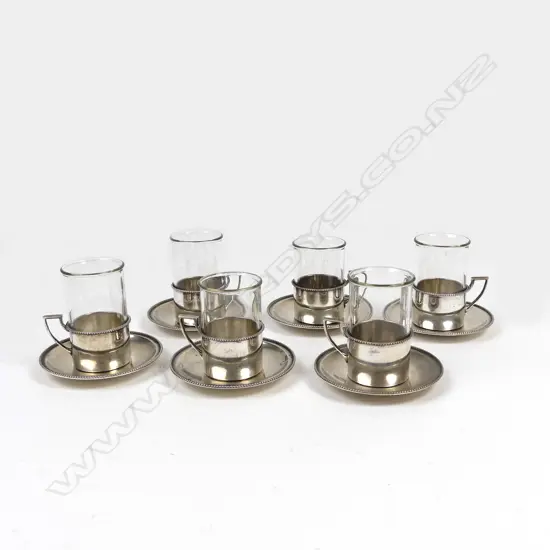 A six place set of Austro-Hungarian .800 silver mounted tea glasses and saucers