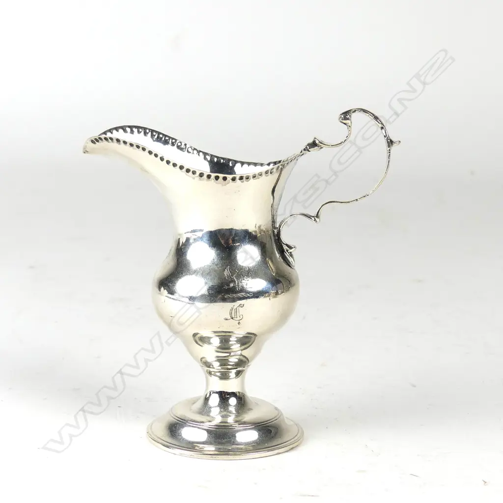 A late Victorian Georgian style pedestal cream jug Image 1++