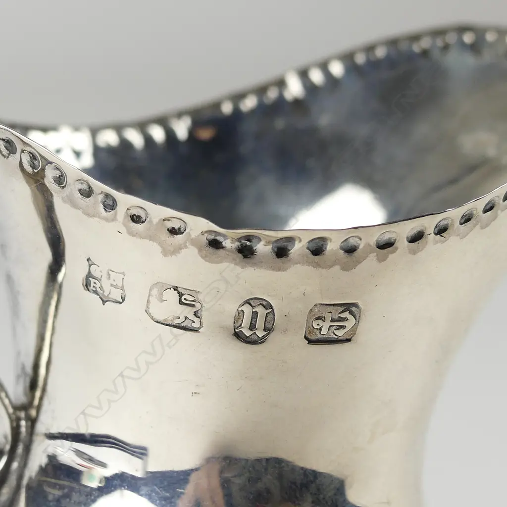 A late Victorian Georgian style pedestal cream jug Image 1++