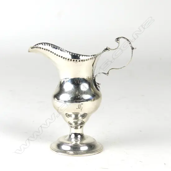 A late Victorian Georgian style pedestal cream jug