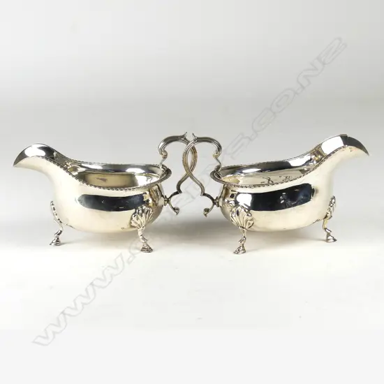 A pair of quality wide bodied silver 1920s gravy boats