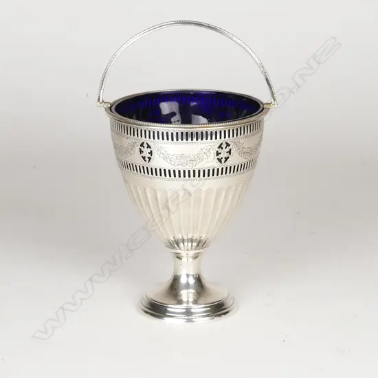 A silver pedestal sugar basket